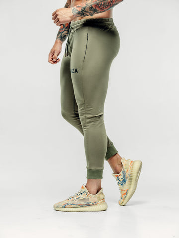 This is a side image of Shane wearing the new standard joggers in khaki.