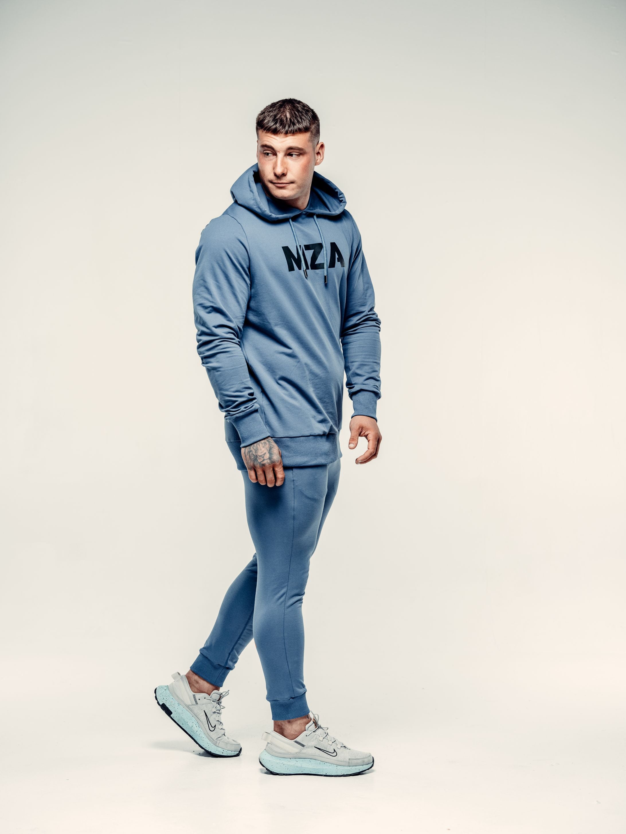 This is lewis wearing the two piece new standard hoodie and joggers combo.  Lewis is taking a step forward and looking back